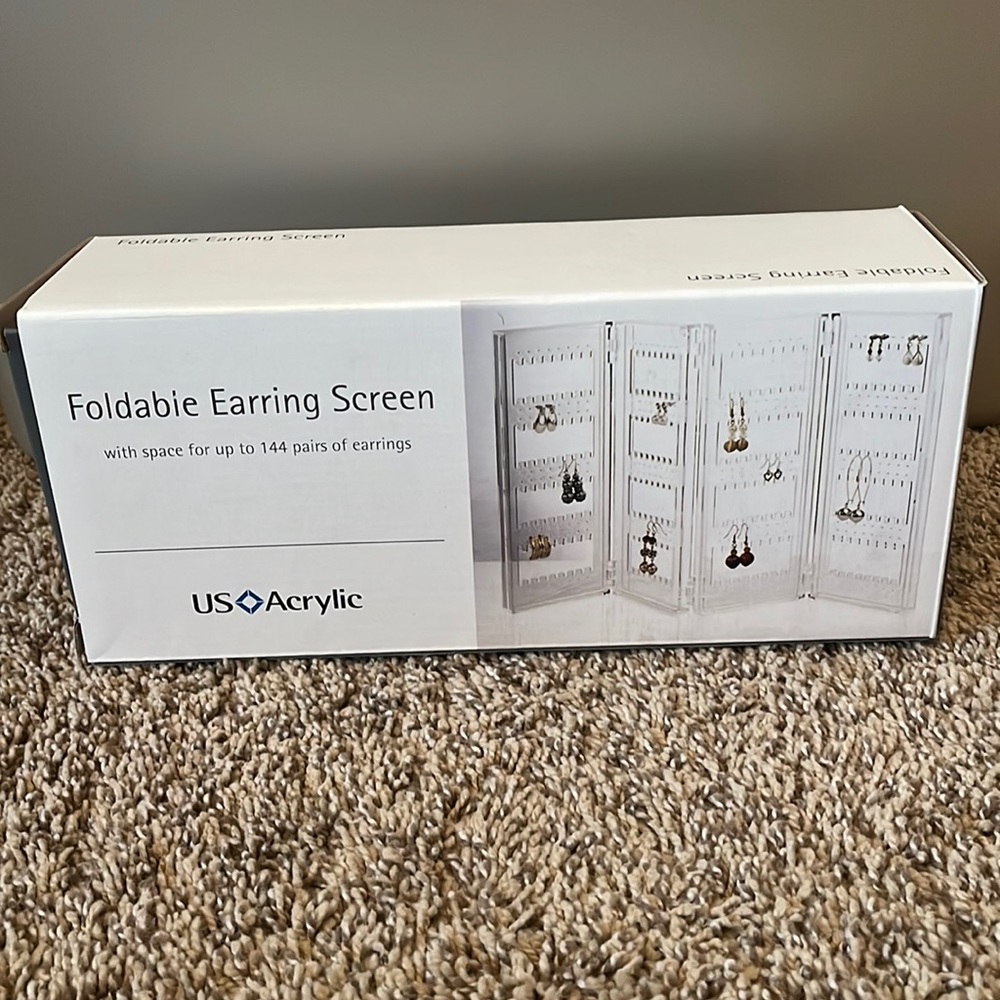 Acrylic Foldable Earring Screen, clear, can hold up to 144 pairs of earrings.